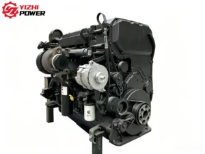 Front angular view of Cummins QST30 heavy duty engine showing alternator and belt pulley system.