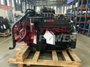 Real factory stock of Cummins QST30 industrial engine assembly on shipping pallet, ready for export.