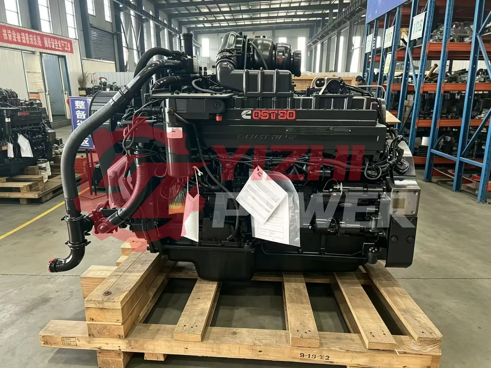 Real factory stock of Cummins QST30 industrial engine assembly on shipping pallet, ready for export.