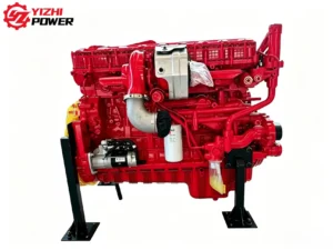 Side view of brand new Cummins X15 diesel engine assembly showing fuel filters and starter motor