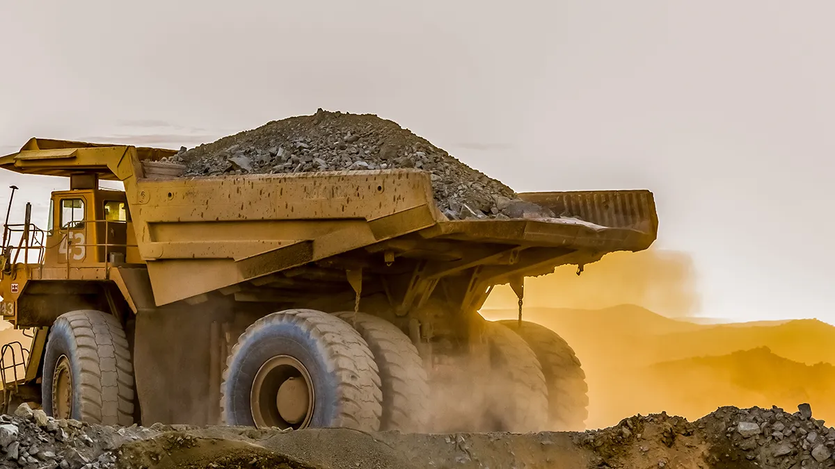 construction equipment engines powering dump trucks for transporting heavy materials