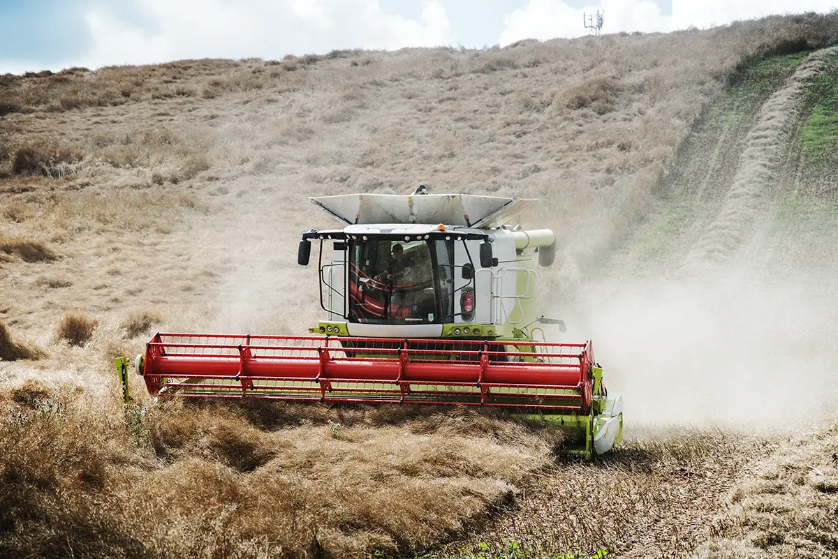 harvester machine powered by engines for agricultural machinery during harvesting