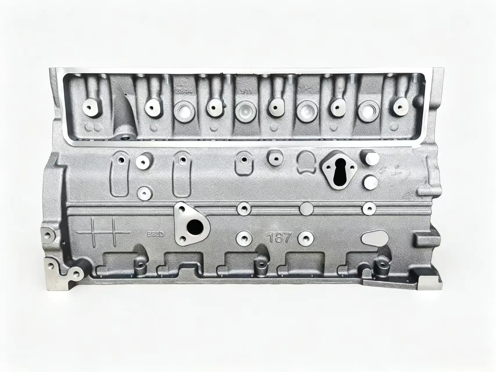 Cummins 6BT cylinder head front view showing OEM casting and combustion chamber surface