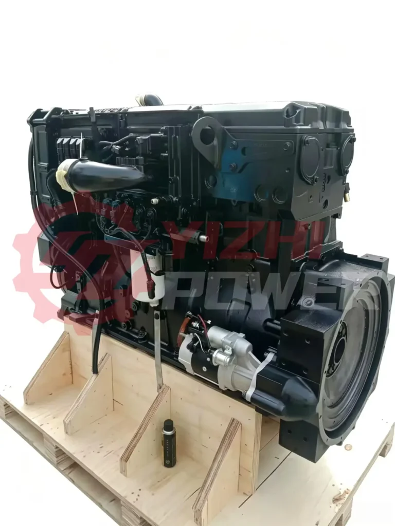 Rear view of an X15 Cummins engine showing the starter motor and flywheel housing alignment for heavy-duty truck maintenance.
