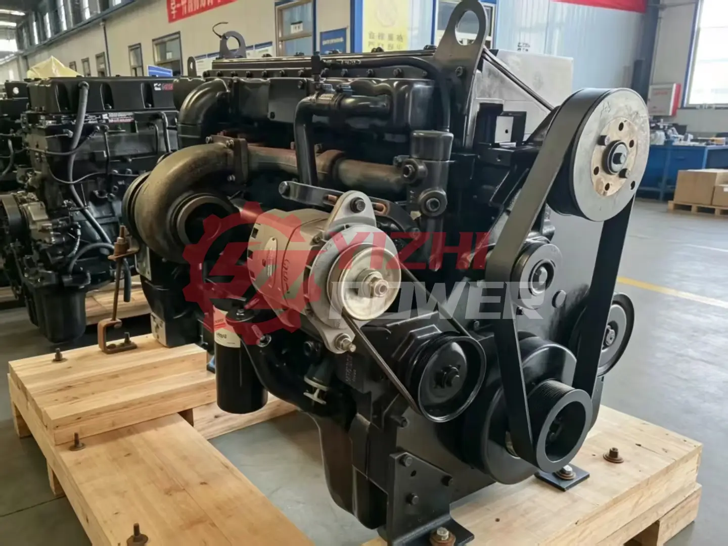 Genuine Cummins M11 diesel engine showing front accessory belt drive and alternator
